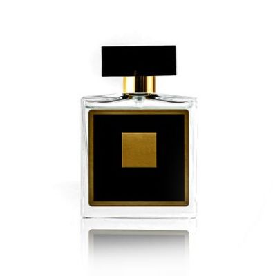 black fragrance bottle with yellow design